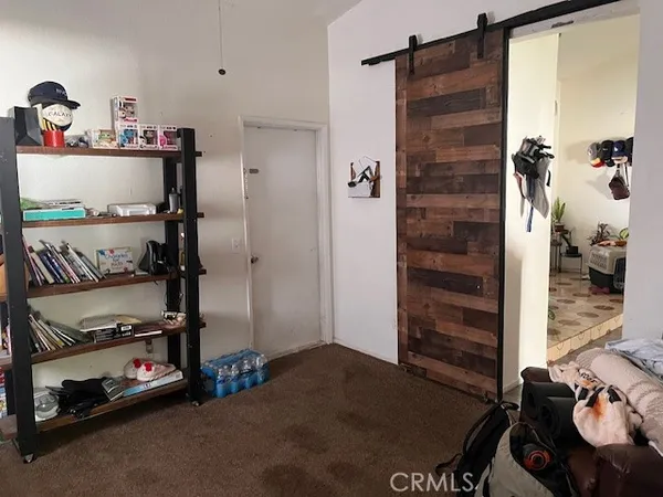 a view of a hallway with closet