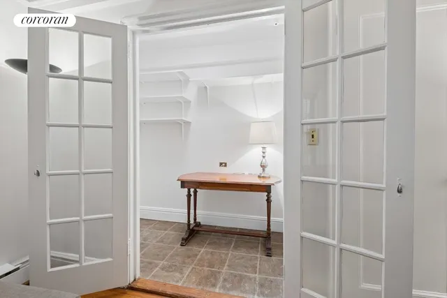 a white kitchen with sink a stove and refrigerator