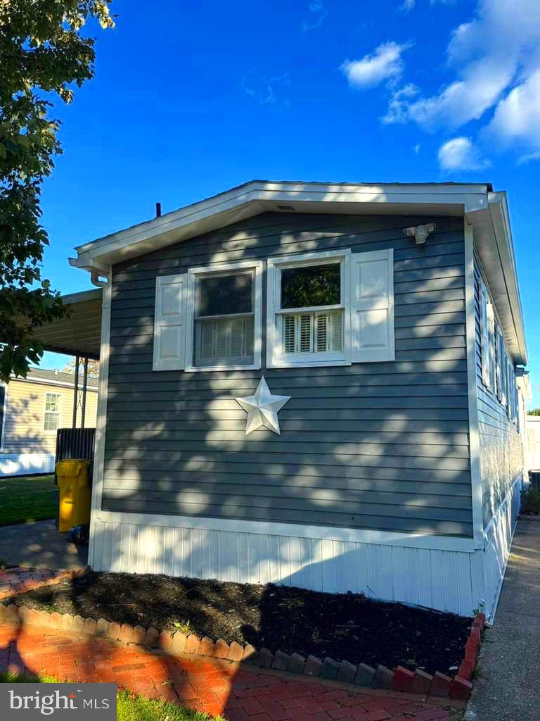 a view of the house with a yard