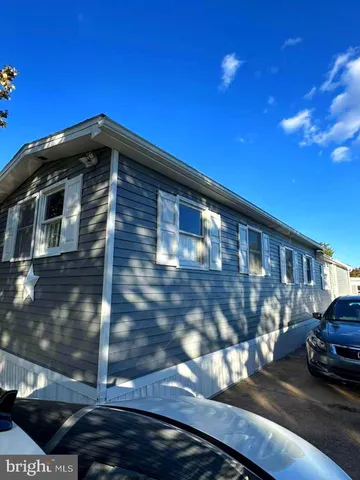 a view of a car parked in front of a building
