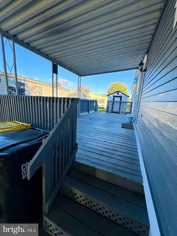 a view of a balcony with wooden floor