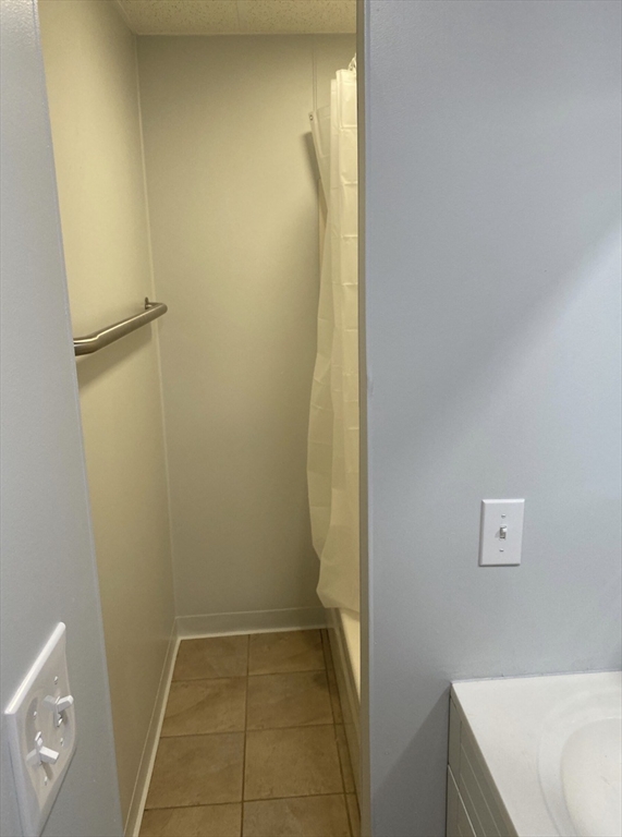 11 Dupont Street, Unit 2 Worcester, MA 01604 - Photo 4 of 6 a bathroom with a sink and a shower