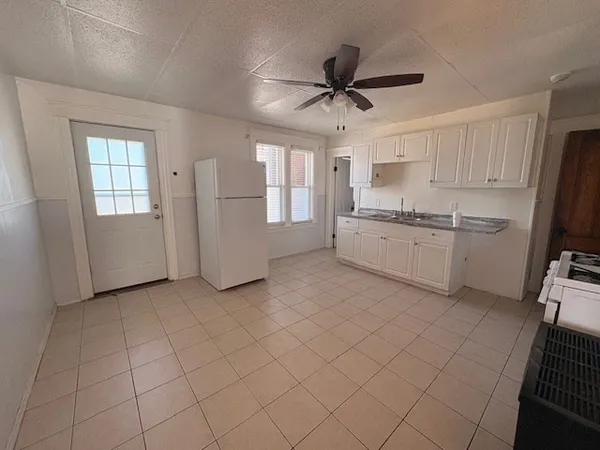 a kitchen with a refrigerator a sink and dishwasher