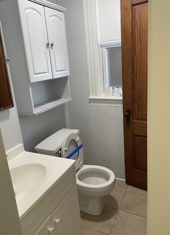 11 Dupont Street, Unit 2 Worcester, MA 01604 - Photo 6 of 6 a bathroom with a toilet sink and mirror