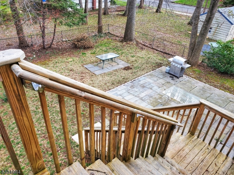 512 Riverside Drive Cranford, NJ 07016 - Photo 11 of 22 a view of a porch with two chairs and a table