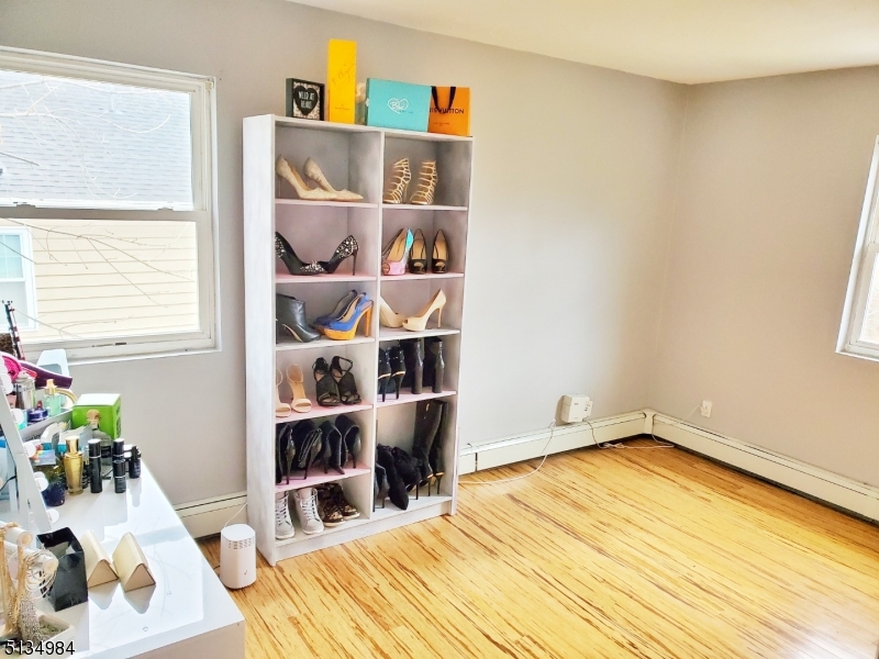 512 Riverside Drive Cranford, NJ 07016 - Photo 17 of 22 a bed room with a bed and a window