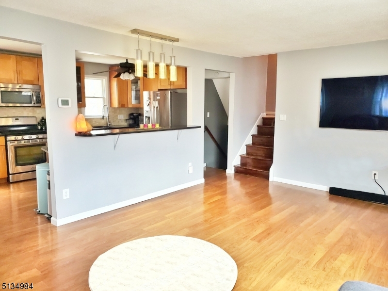 512 Riverside Drive Cranford, NJ 07016 - Photo 6 of 22 a view of a living room and a flat screen tv