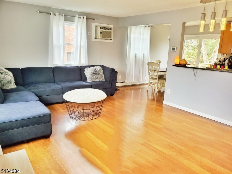512 Riverside Drive Cranford, NJ 07016 - Photo 7 of 22 a living room with furniture and a large window