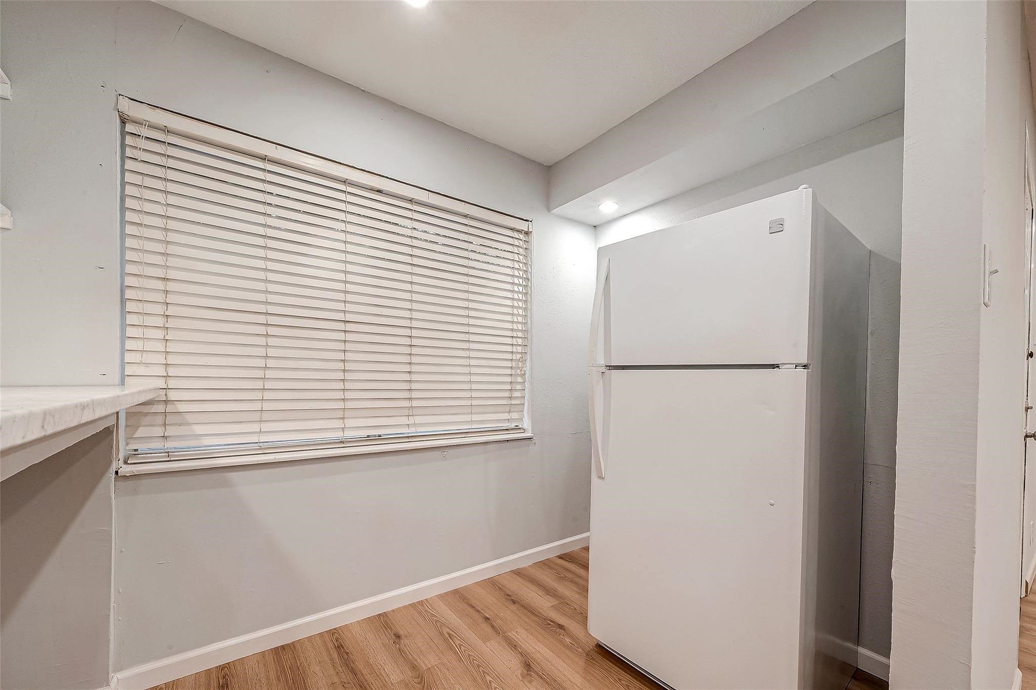 23131 Earlmist Drive Spring, TX 77373 - Photo 11 of 34 a view of a kitchen with a white cabinet and a refrigerator