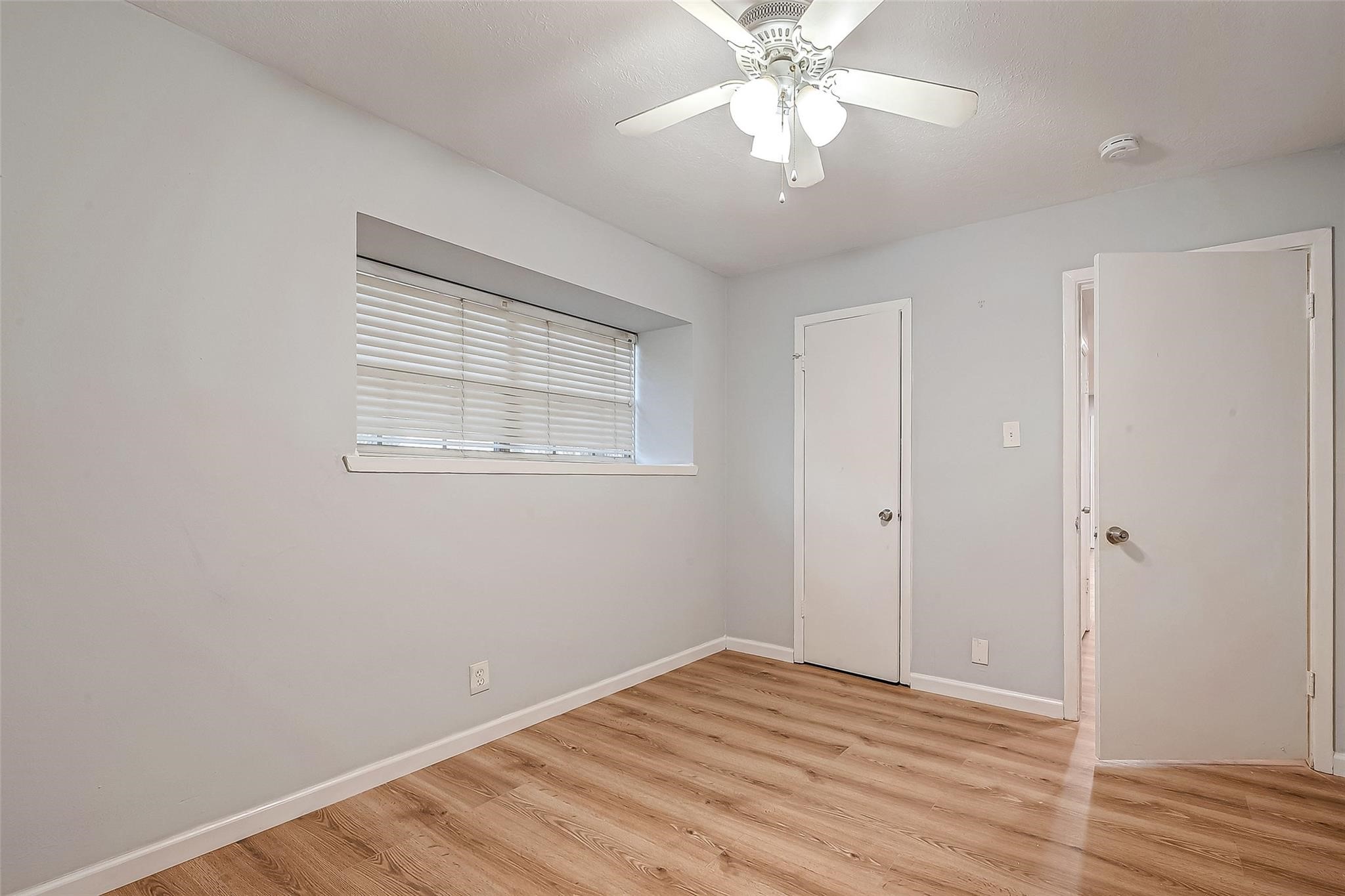 23131 Earlmist Drive Spring, TX 77373 - Photo 21 of 34 a view of empty room with wooden floor and fan
