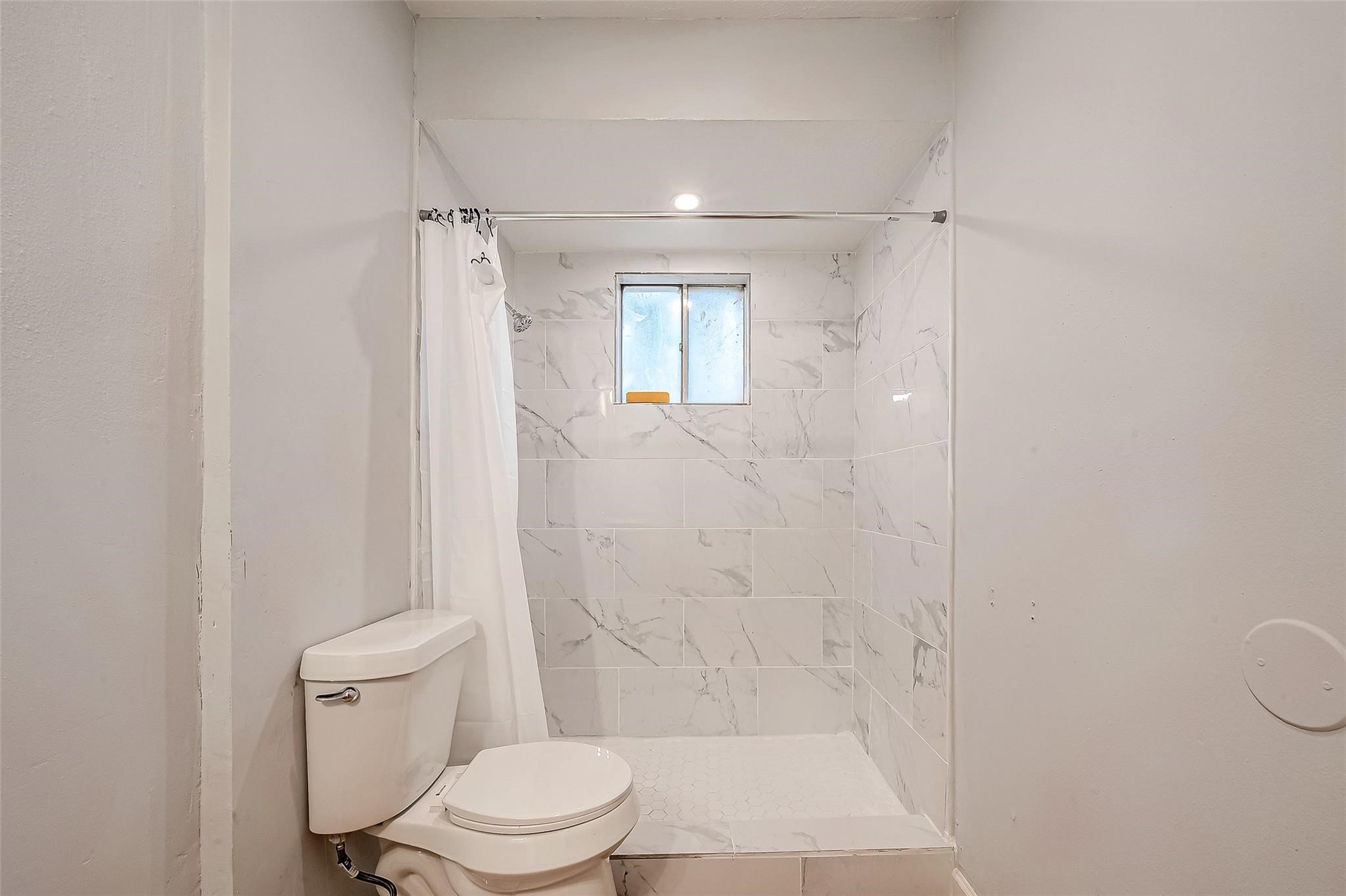 23131 Earlmist Drive Spring, TX 77373 - Photo 24 of 34 a bathroom with a toilet and a shower