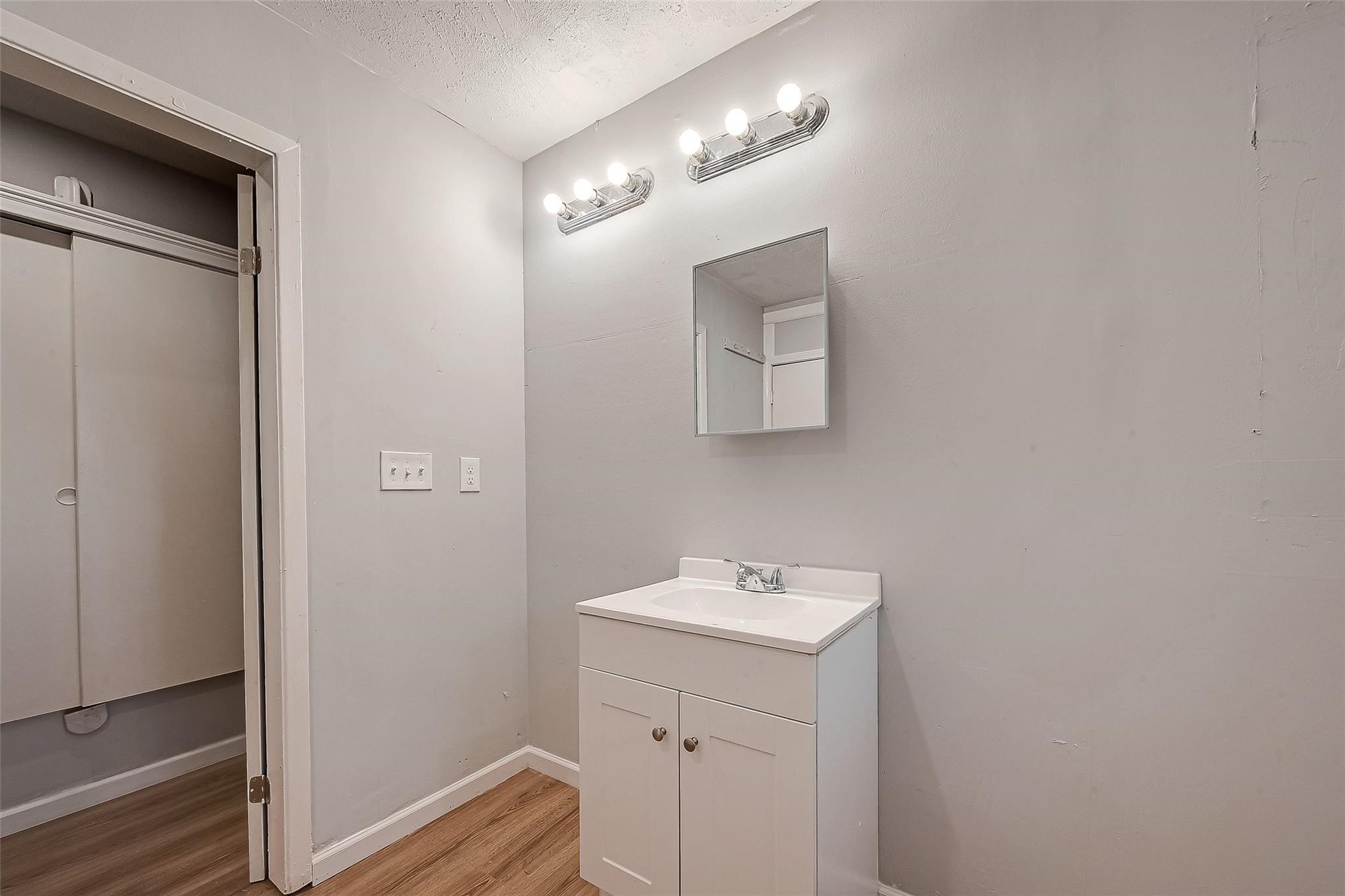 23131 Earlmist Drive Spring, TX 77373 - Photo 29 of 34 a bathroom with a sink a light fixture and a mirror