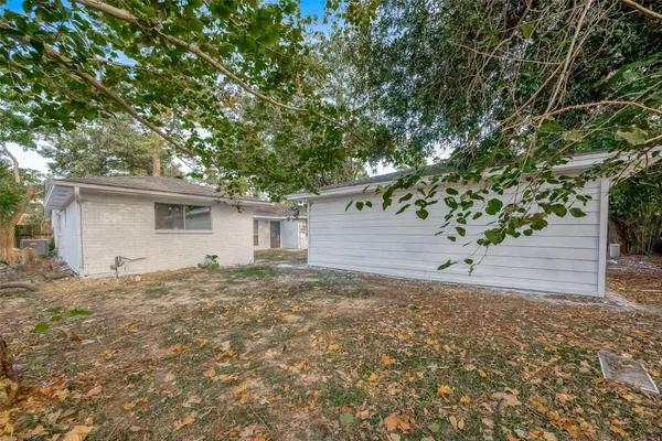 a view of a house with a tree in the background