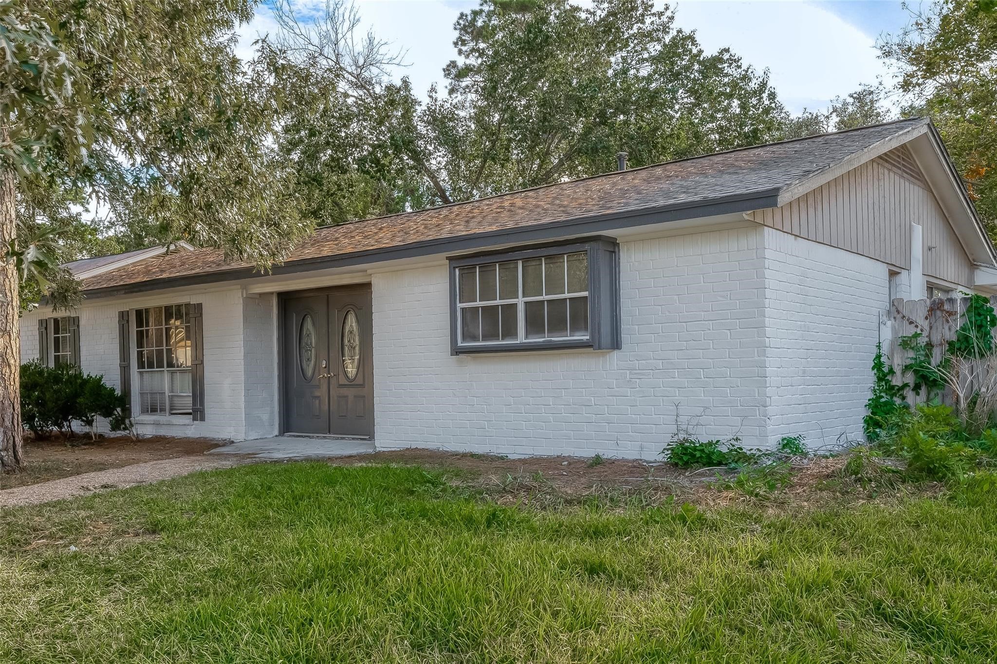 23131 Earlmist Drive Spring, TX 77373 - Photo 5 of 34 a front view of house with yard and green space