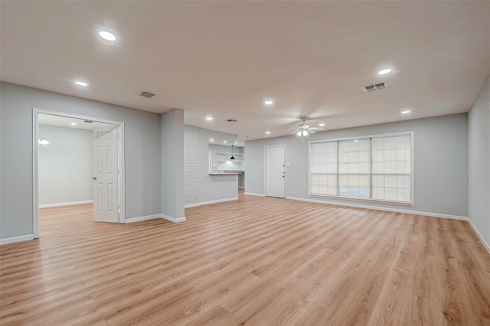 23131 Earlmist Drive Spring, TX 77373 - Photo 7 of 34 a view of empty room with wooden floor and windows