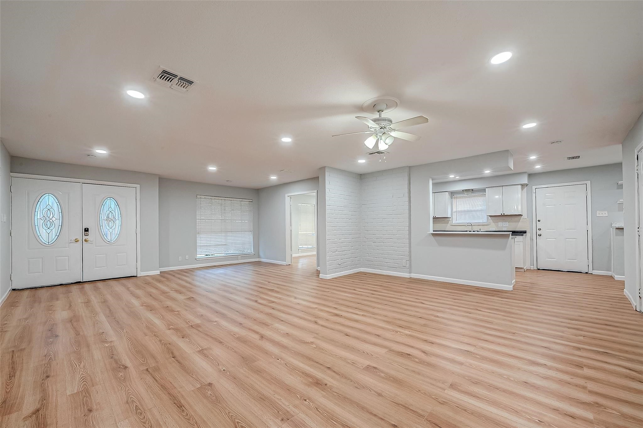 23131 Earlmist Drive Spring, TX 77373 - Photo 8 of 34 a view of an empty room with kitchen view and a window