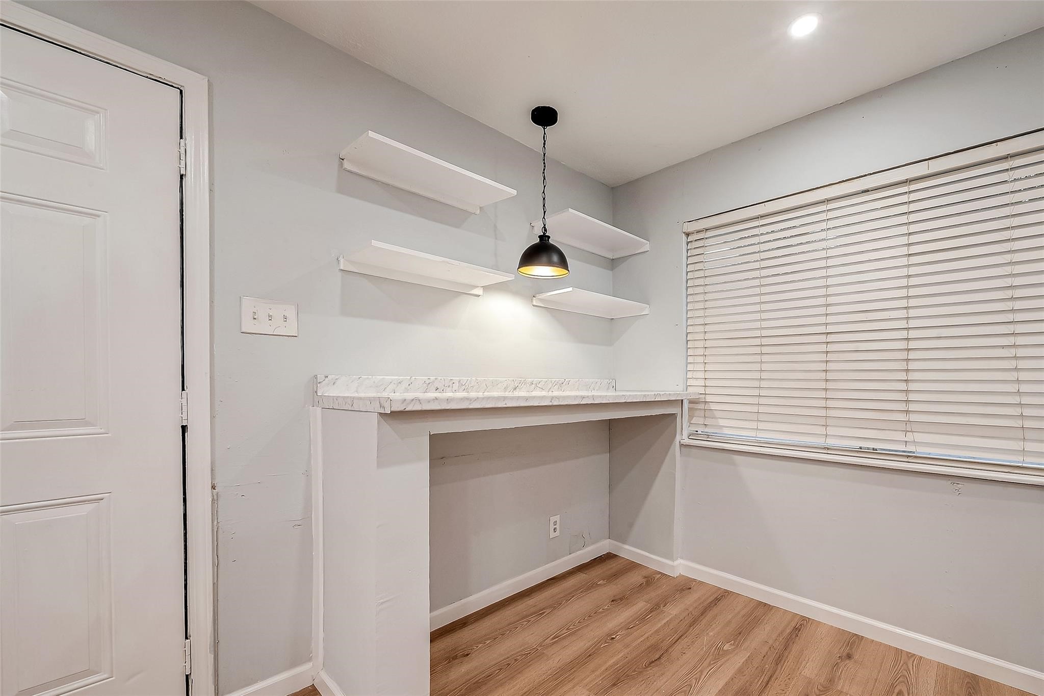 23131 Earlmist Drive Spring, TX 77373 - Photo 10 of 34 a view of an empty room with wooden floor and a window