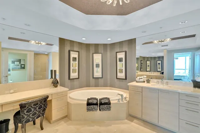 a view of a chairs and table in a balcony