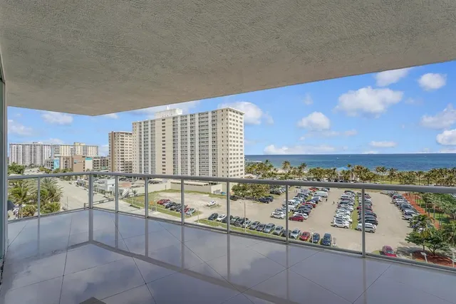 an aerial view of a house with yard swimming pool and outdoor seating