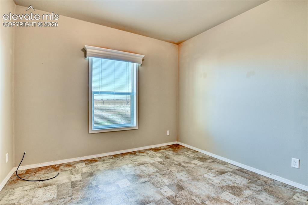 22558 Enoch Road Calhan, CO 80808 - Photo 20 of 50 an empty room with a window