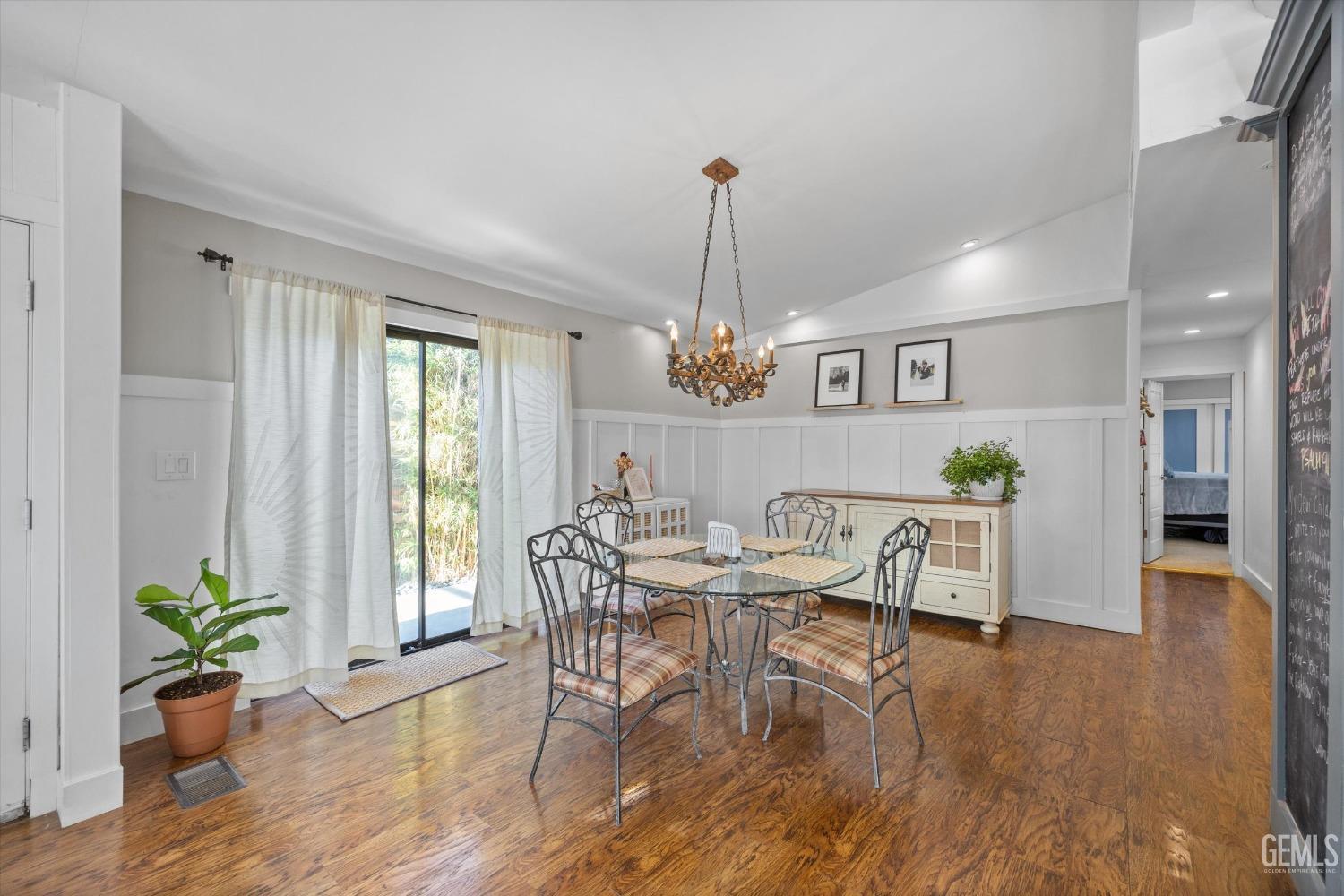 Undisclosed Address Bakersfield, CA 93306 - Photo 13 of 39 a view of a dining room with furniture window and wooden floor