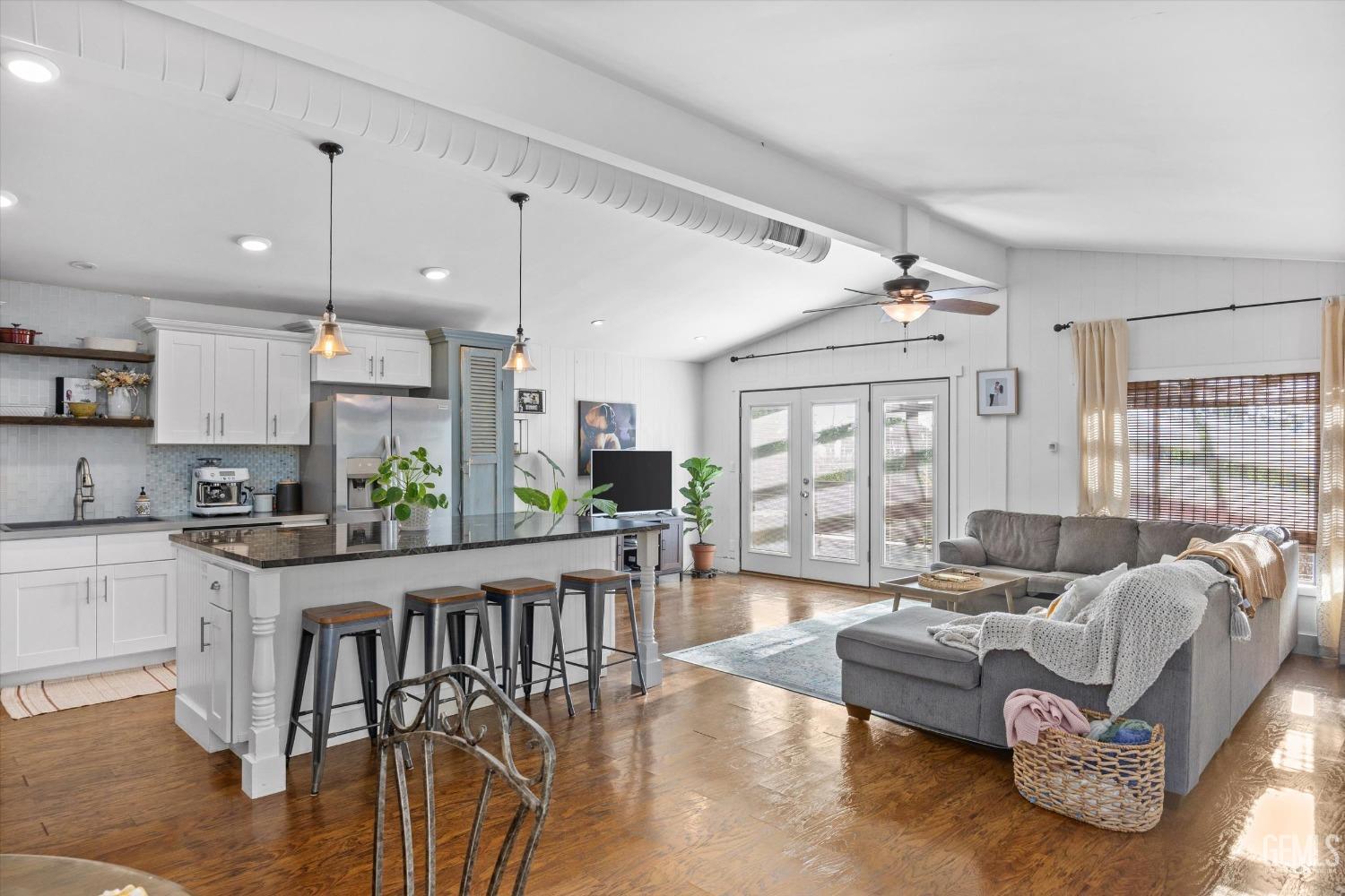 Undisclosed Address Bakersfield, CA 93306 - Photo 16 of 39 a living room with furniture a wooden floor and a window
