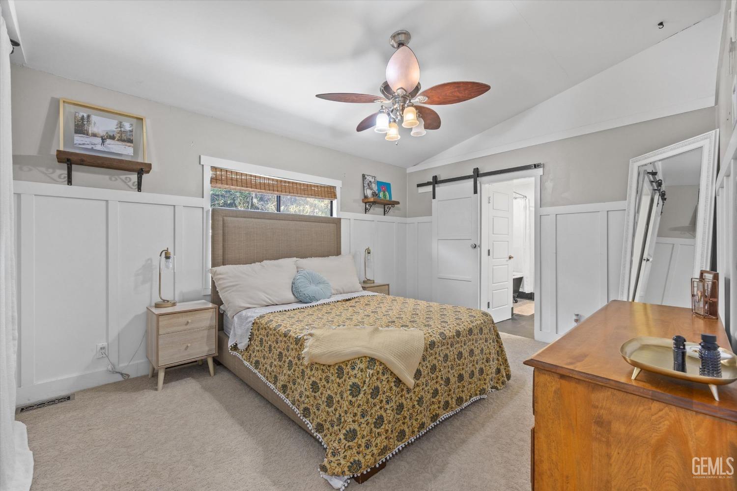 Undisclosed Address Bakersfield, CA 93306 - Photo 20 of 39 a bedroom with a bed and a chandelier