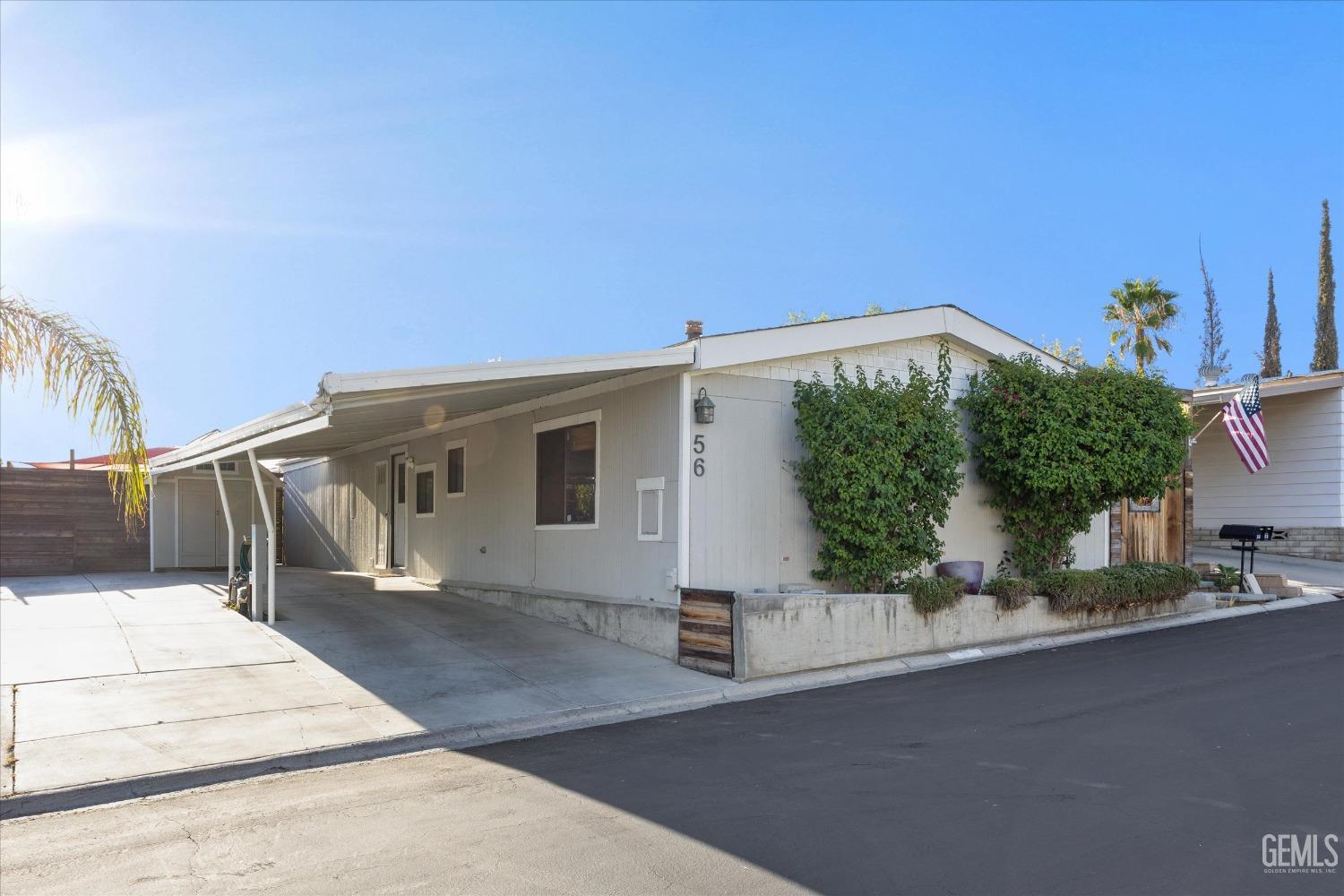 Undisclosed Address Bakersfield, CA 93306 - Photo 2 of 39 a front view of a house with a garage