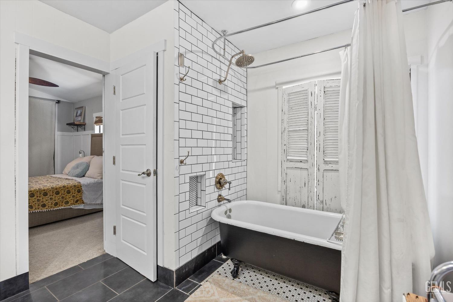 Undisclosed Address Bakersfield, CA 93306 - Photo 24 of 39 a bathroom with a tub shower and sink