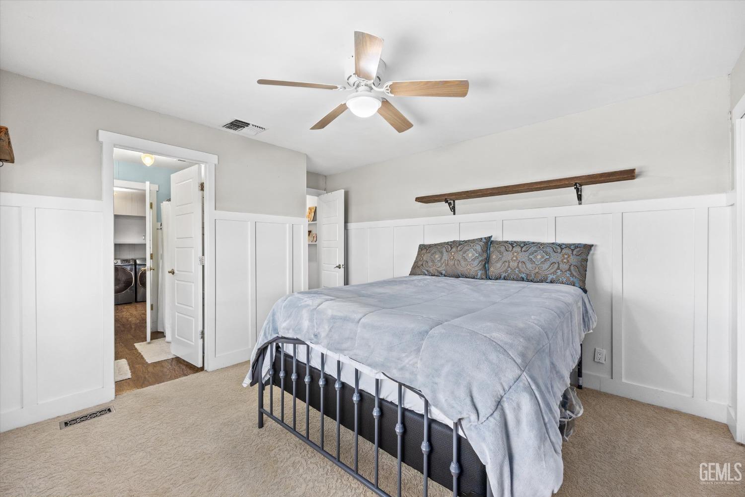 Undisclosed Address Bakersfield, CA 93306 - Photo 27 of 39 a bedroom with a bed and a ceiling fan