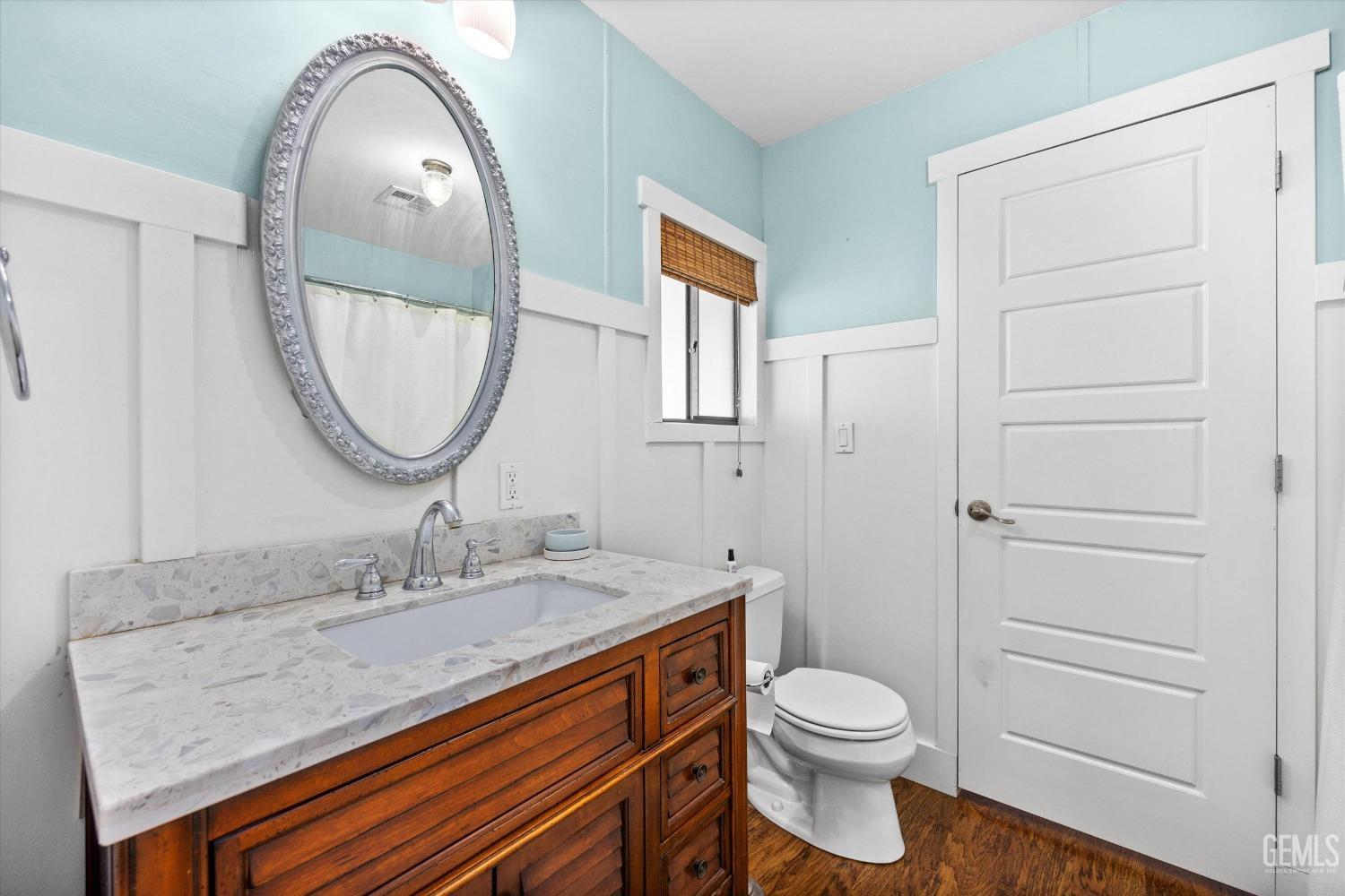 Undisclosed Address Bakersfield, CA 93306 - Photo 28 of 39 a bathroom with a granite countertop sink toilet and a mirror