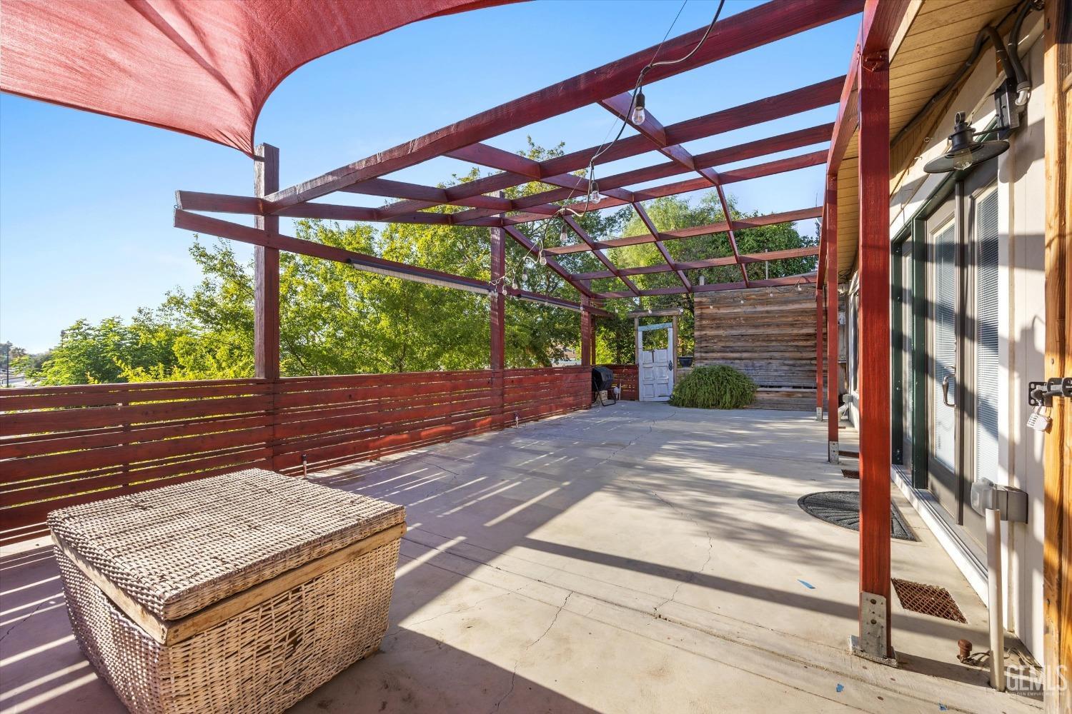 Undisclosed Address Bakersfield, CA 93306 - Photo 36 of 39 a view of a patio with a table chairs and a backyard
