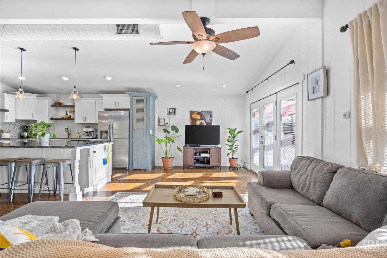 Undisclosed Address Bakersfield, CA 93306 - Photo 6 of 39 a living room with furniture kitchen view and a chandelier