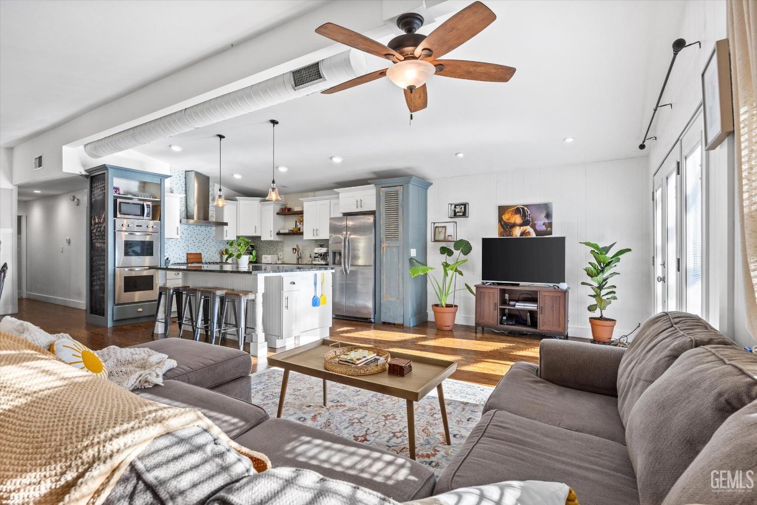Undisclosed Address Bakersfield, CA 93306 - Photo 7 of 39 a living room with furniture a fireplace and a chandelier