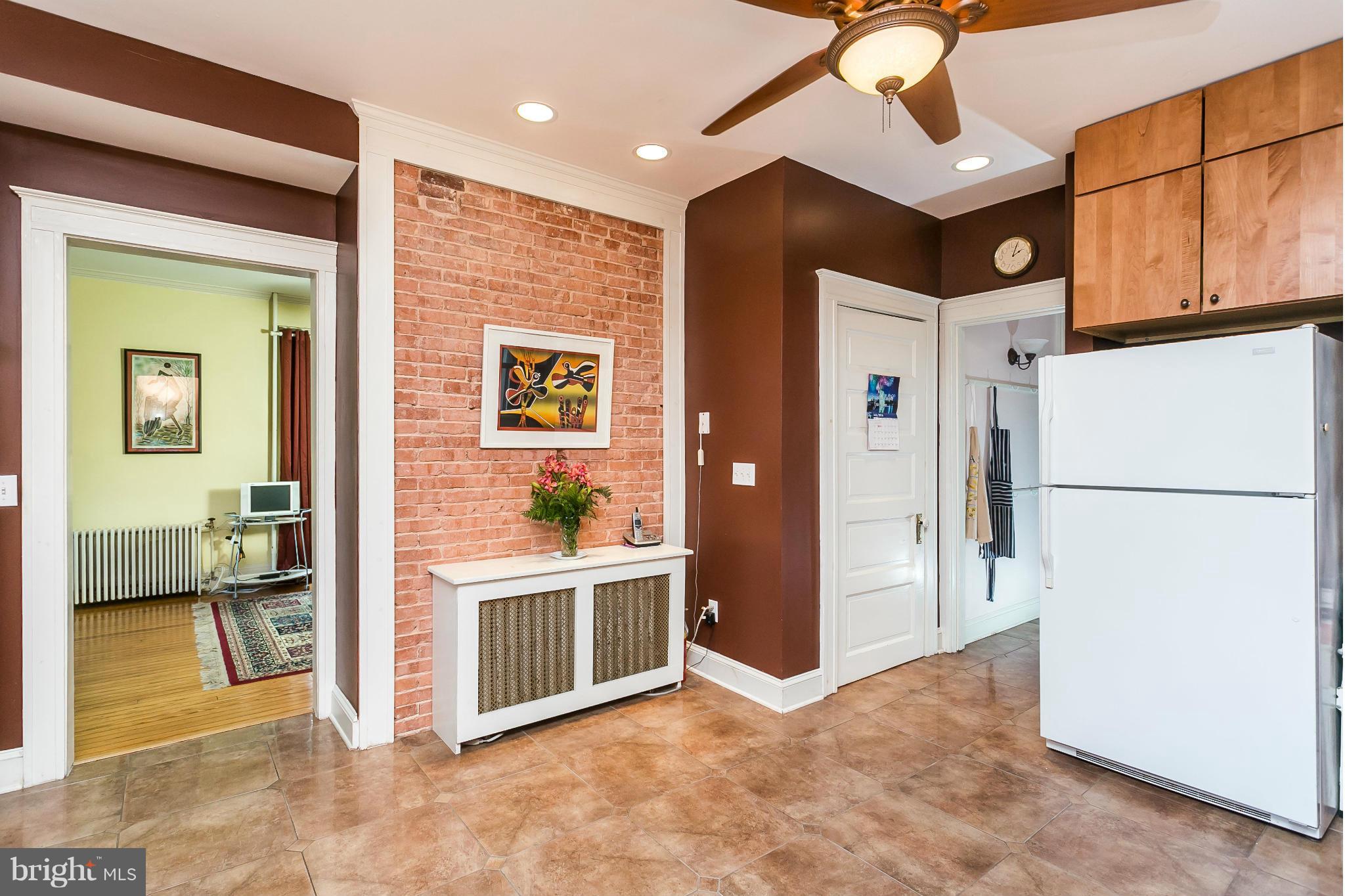 109 Woodlawn Road Baltimore, MD 21210 - Photo 12 of 30 Kitchen (with exposed brick)
