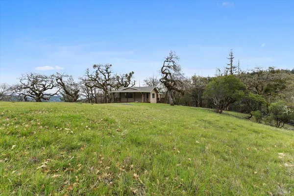 a view of a house with a big yard