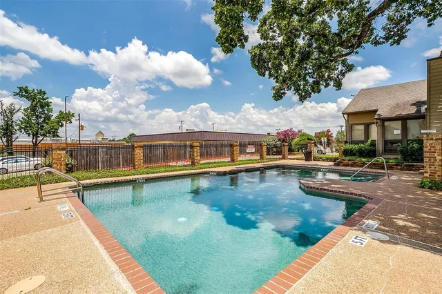 a view of a swimming pool with a lounge chair