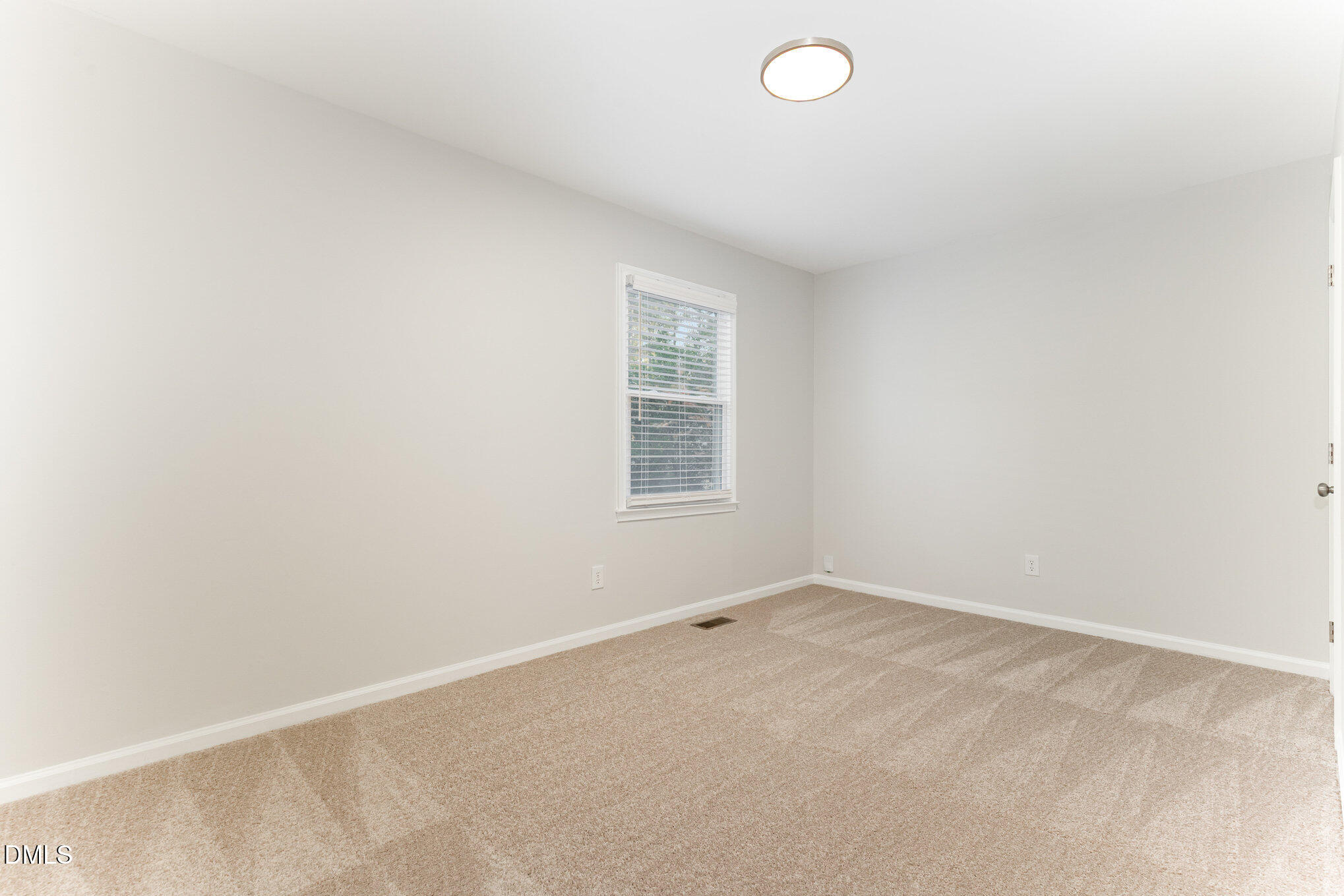 7717 Cart Track Trail Raleigh, NC 27615 - Photo 15 of 18 an empty room with a window