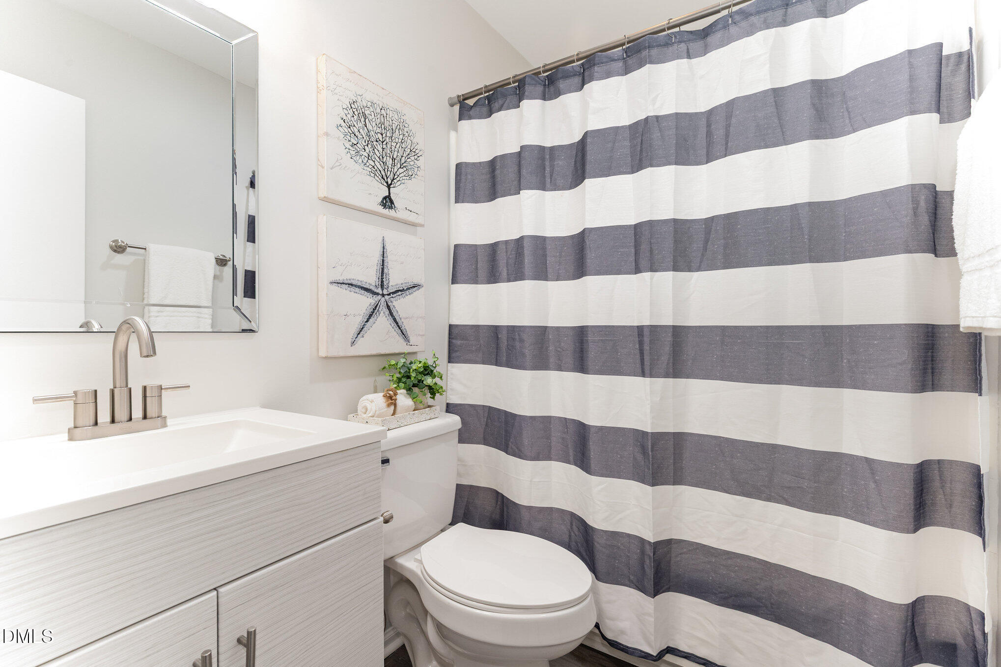 7717 Cart Track Trail Raleigh, NC 27615 - Photo 16 of 18 a bathroom with a sink toilet and shower