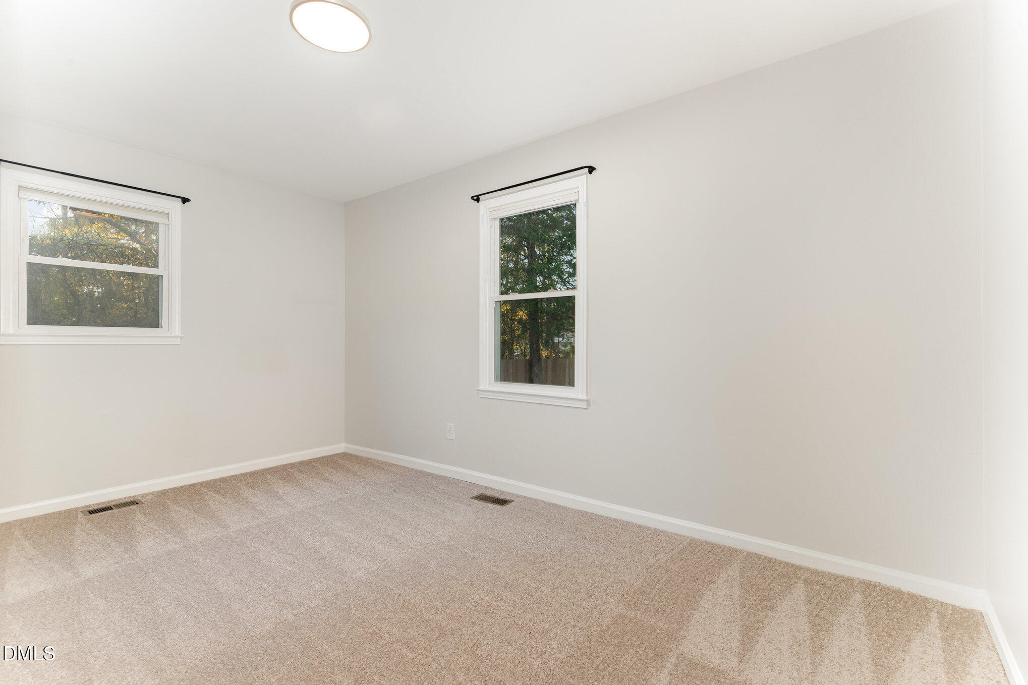 7717 Cart Track Trail Raleigh, NC 27615 - Photo 17 of 18 an empty room with a window