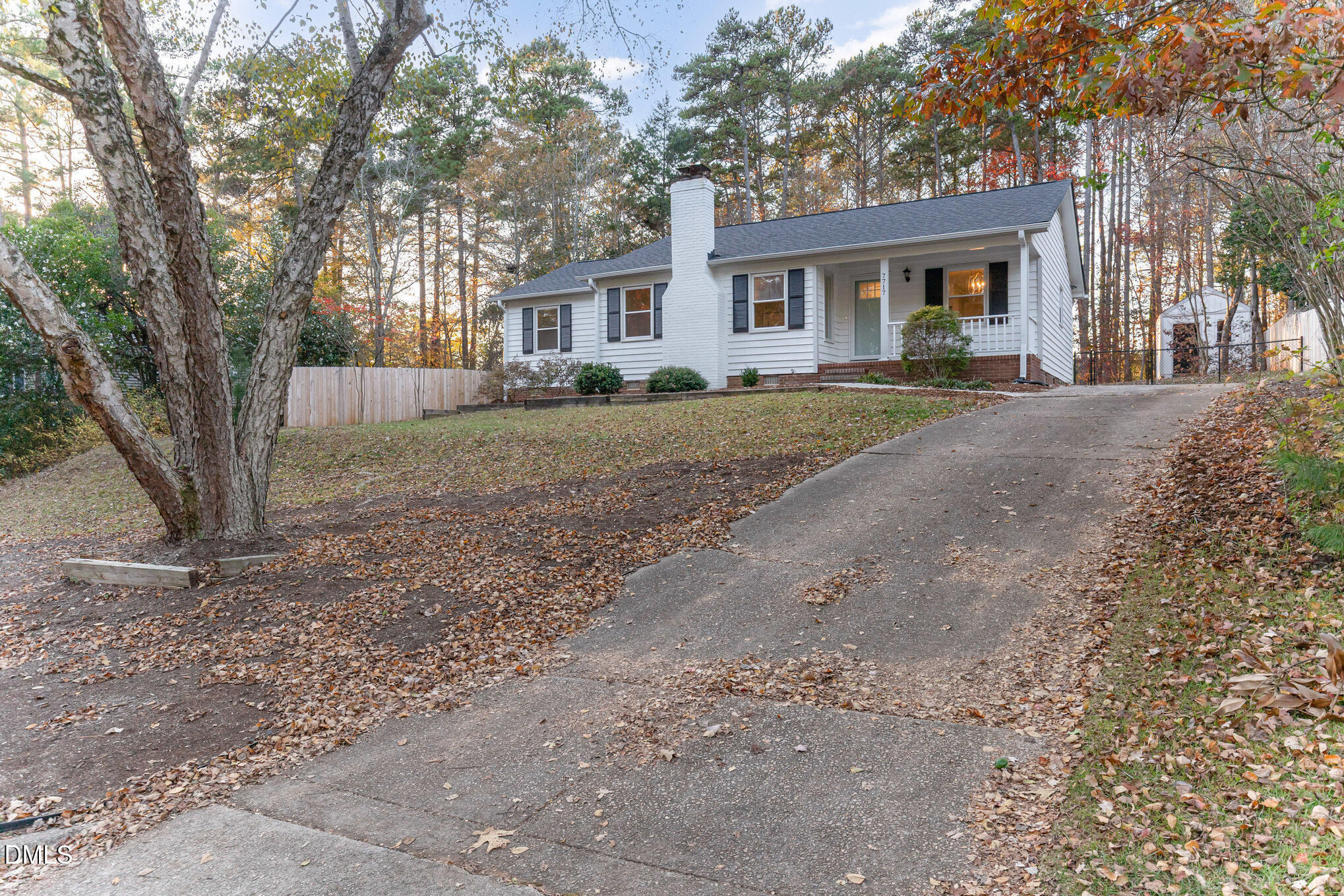7717 Cart Track Trail Raleigh, NC 27615 - Photo 2 of 18 a front view of a house with a yard and trees