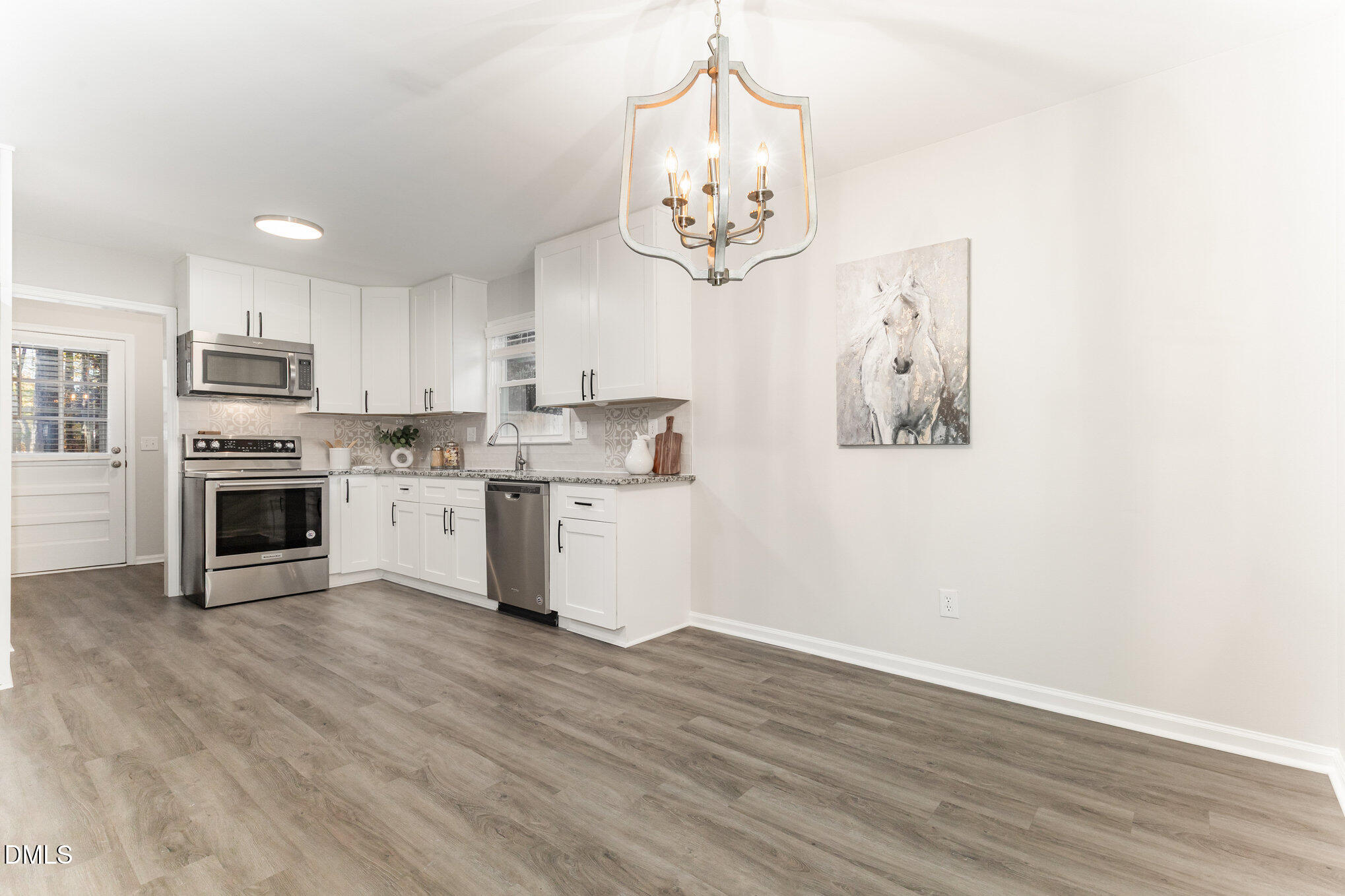 7717 Cart Track Trail Raleigh, NC 27615 - Photo 7 of 18 a view of kitchen with sink and microwave