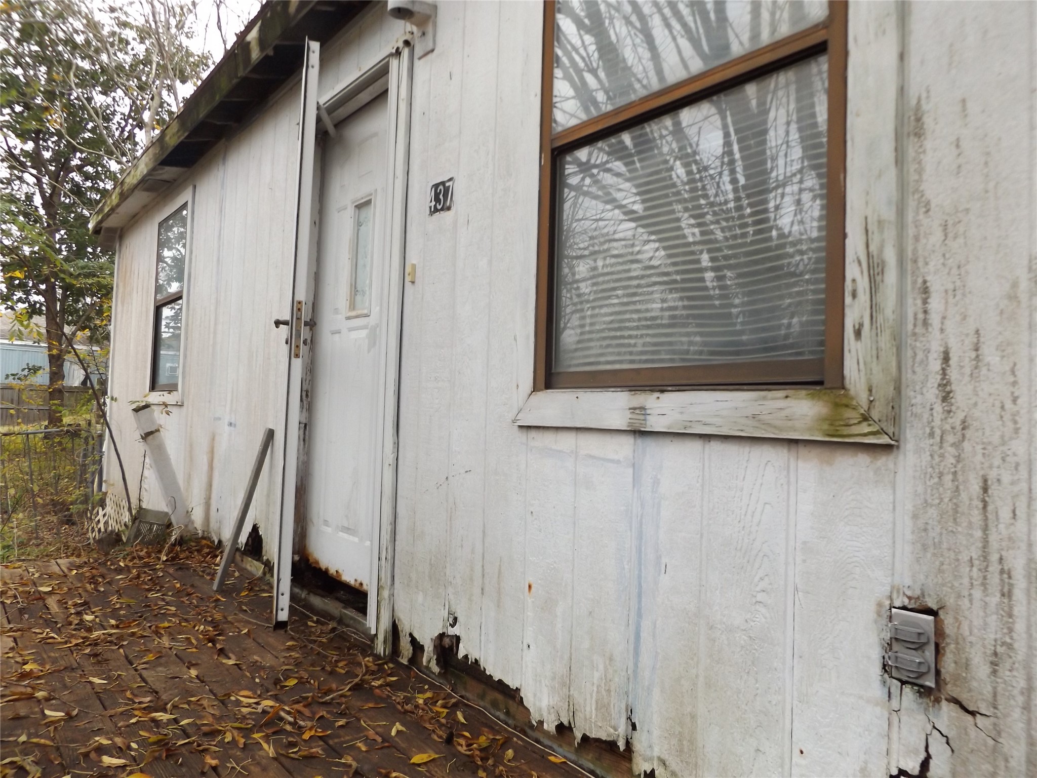 437 8th Street Dickinson, TX 77539 - Photo 2 of 12 a view of a house with a small yard
