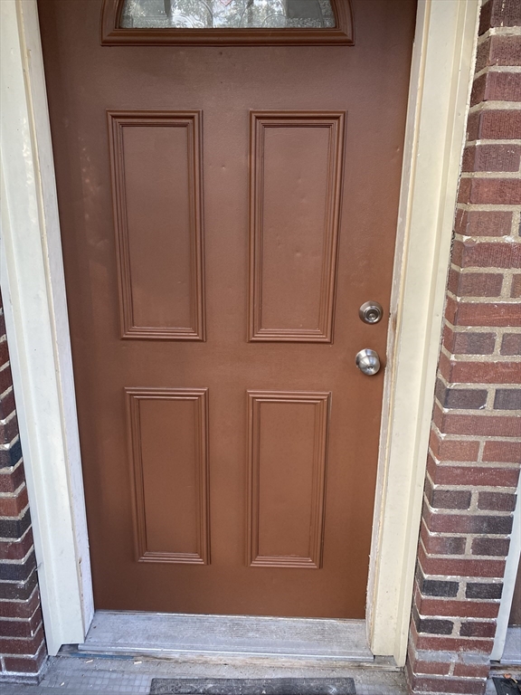 a view of front door with stairs