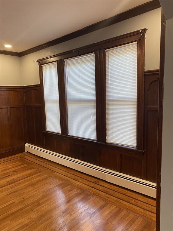 39 Pasadena Road, Unit 2 Boston, MA 02121 - Photo 15 of 29 a view of a room with wooden floor and windows