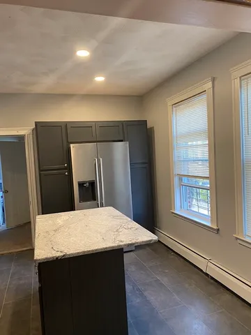 a kitchen with a stove and a refrigerator