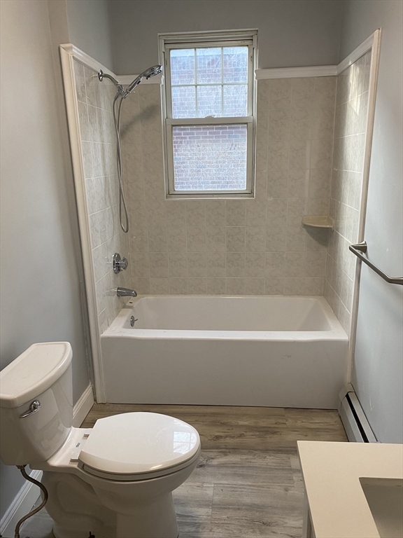 39 Pasadena Road, Unit 2 Boston, MA 02121 - Photo 8 of 29 a bathroom with a toilet and a bathtub