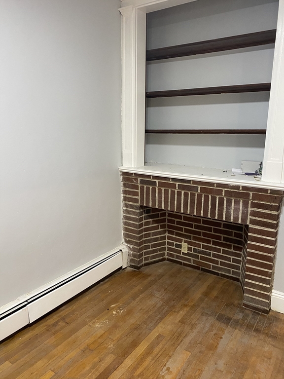 39 Pasadena Road, Unit 2 Boston, MA 02121 - Photo 9 of 29 a view of a room with wooden floor
