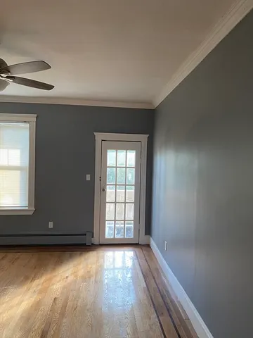 a view of room with wooden floor