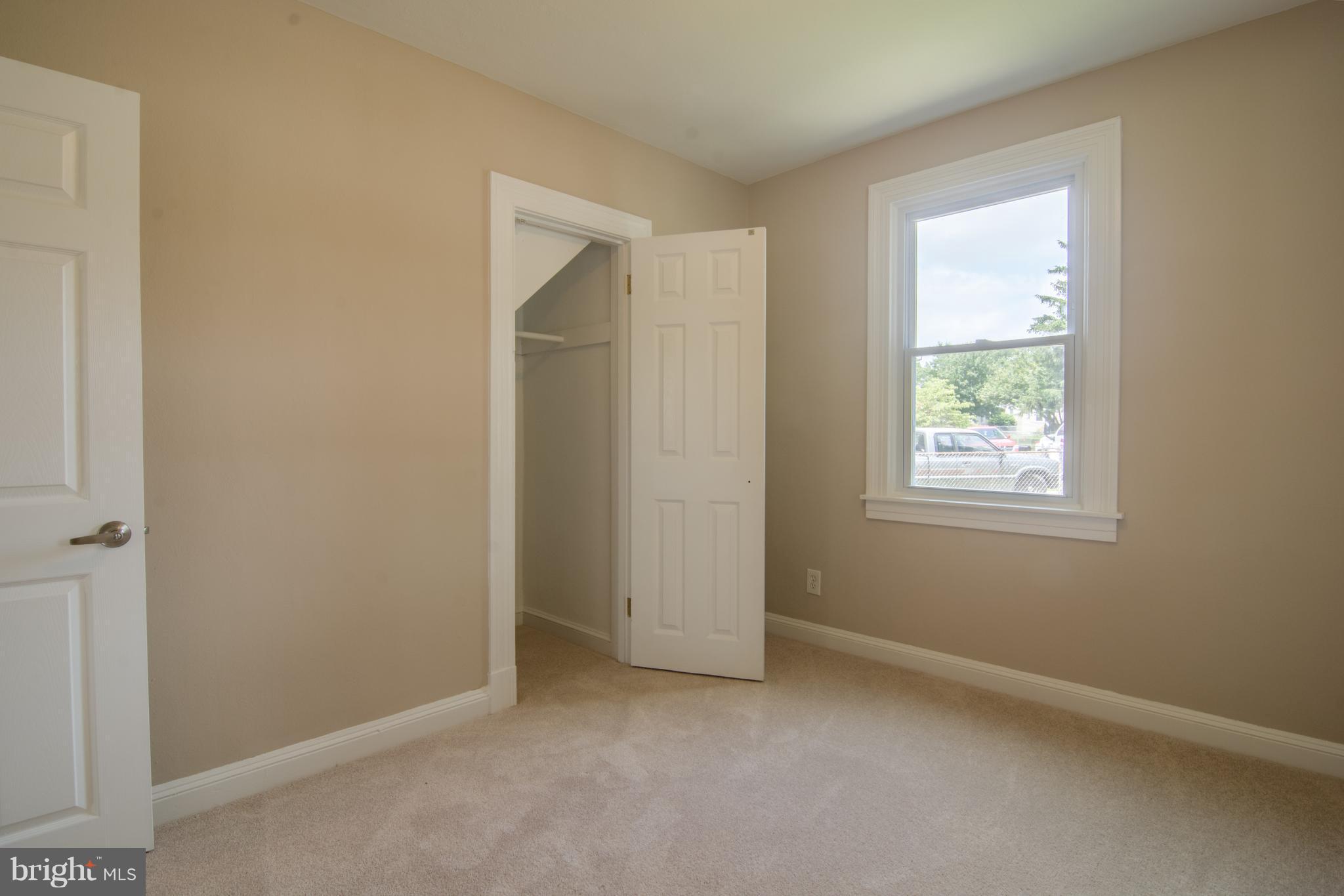 33 Riverside Road Essex, MD 21221 - Photo 22 of 31 an empty room with windows and closet